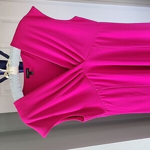 DRESS.. Mid length ..V neck. Pleated breast bodice. Flowing